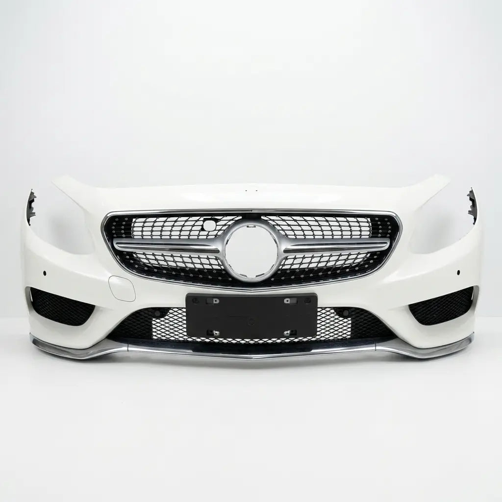 Car front bumper with grille on a white background