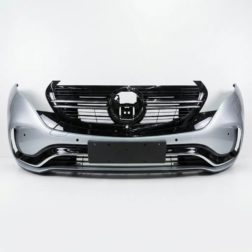 Car front bumper with chrome accents on a white background